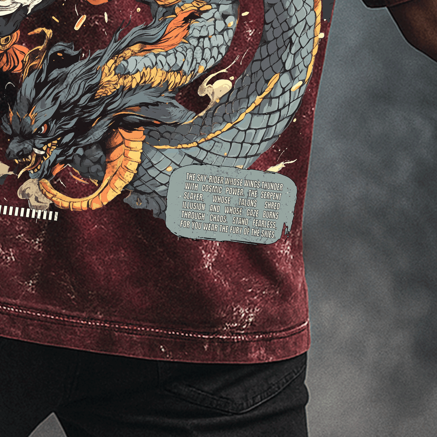 Man wearing Garuda: The Serpent Slayer T-shirt with a dragon and eagle design on the back against a dark background.