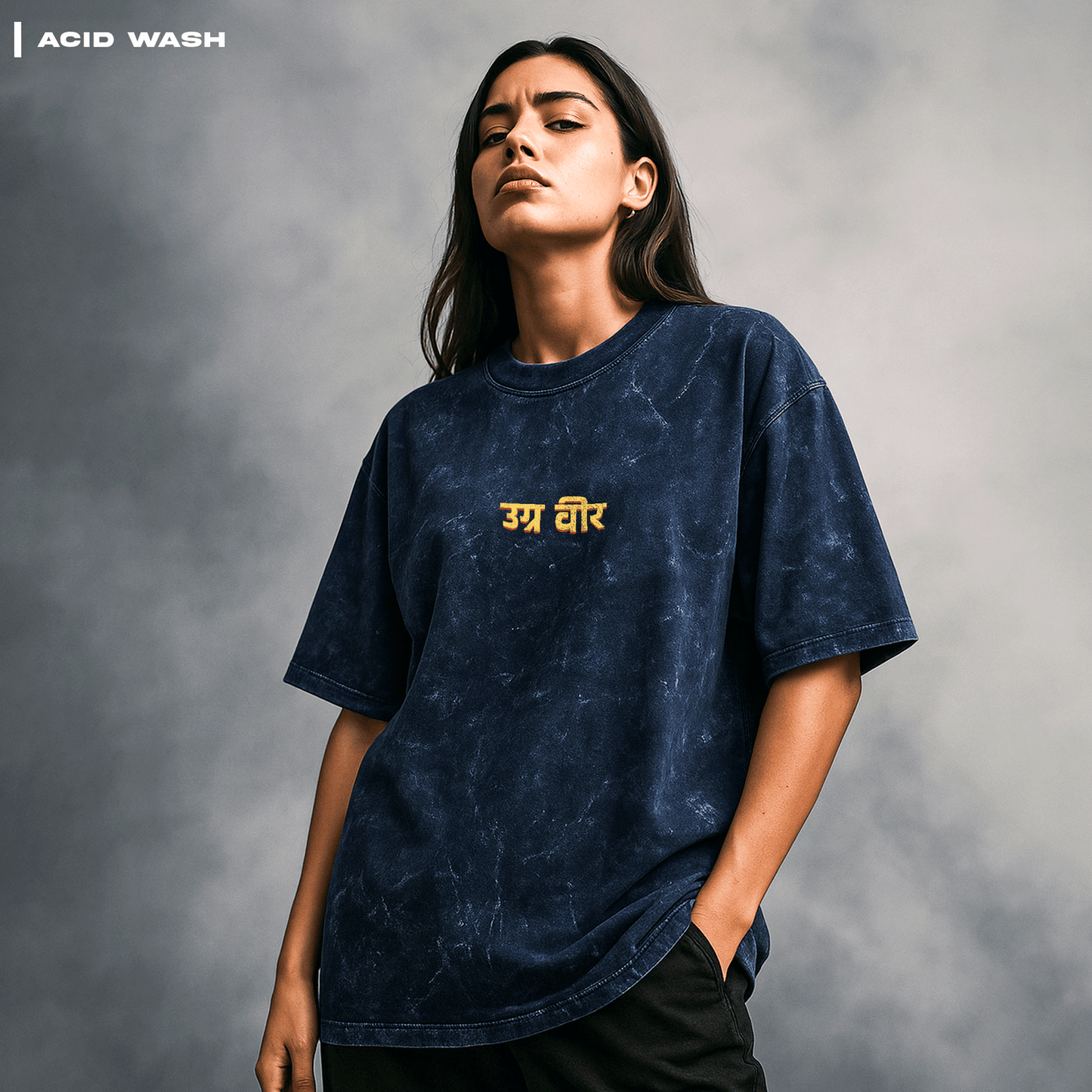Person wearing a navy acid-wash t-shirt with yellow text on a gray background. Parashu: The Mighty Axe T-shirt Covert