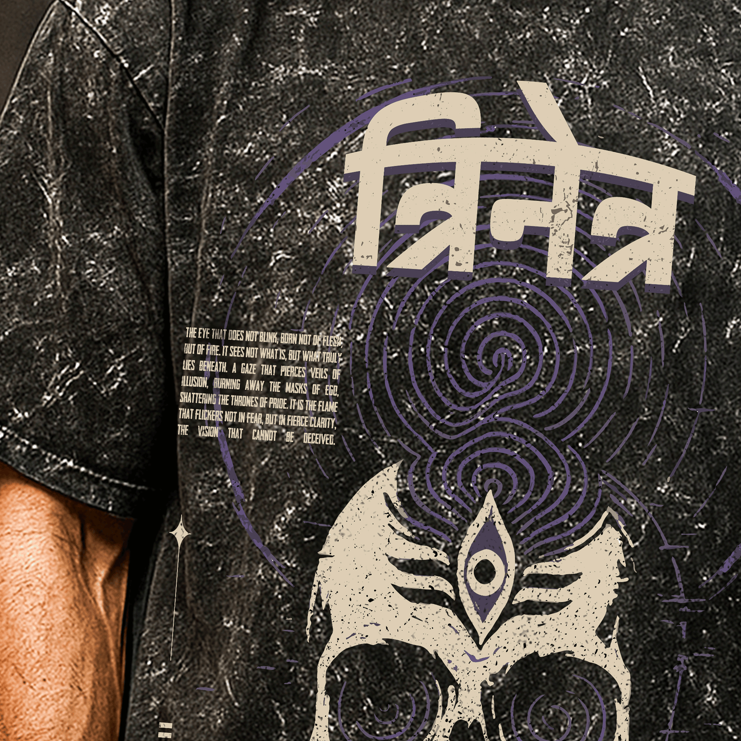 Black t-shirt with intricate design and text on a person wearing it. Trinetra T-shirt Covert