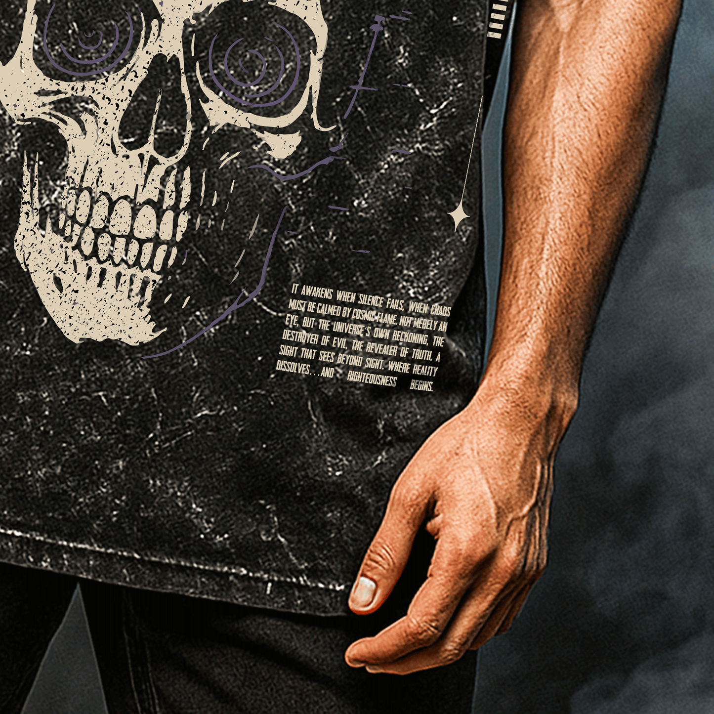 Person wearing a black t-shirt with a skull design and text. Trinetra T-shirt Covert