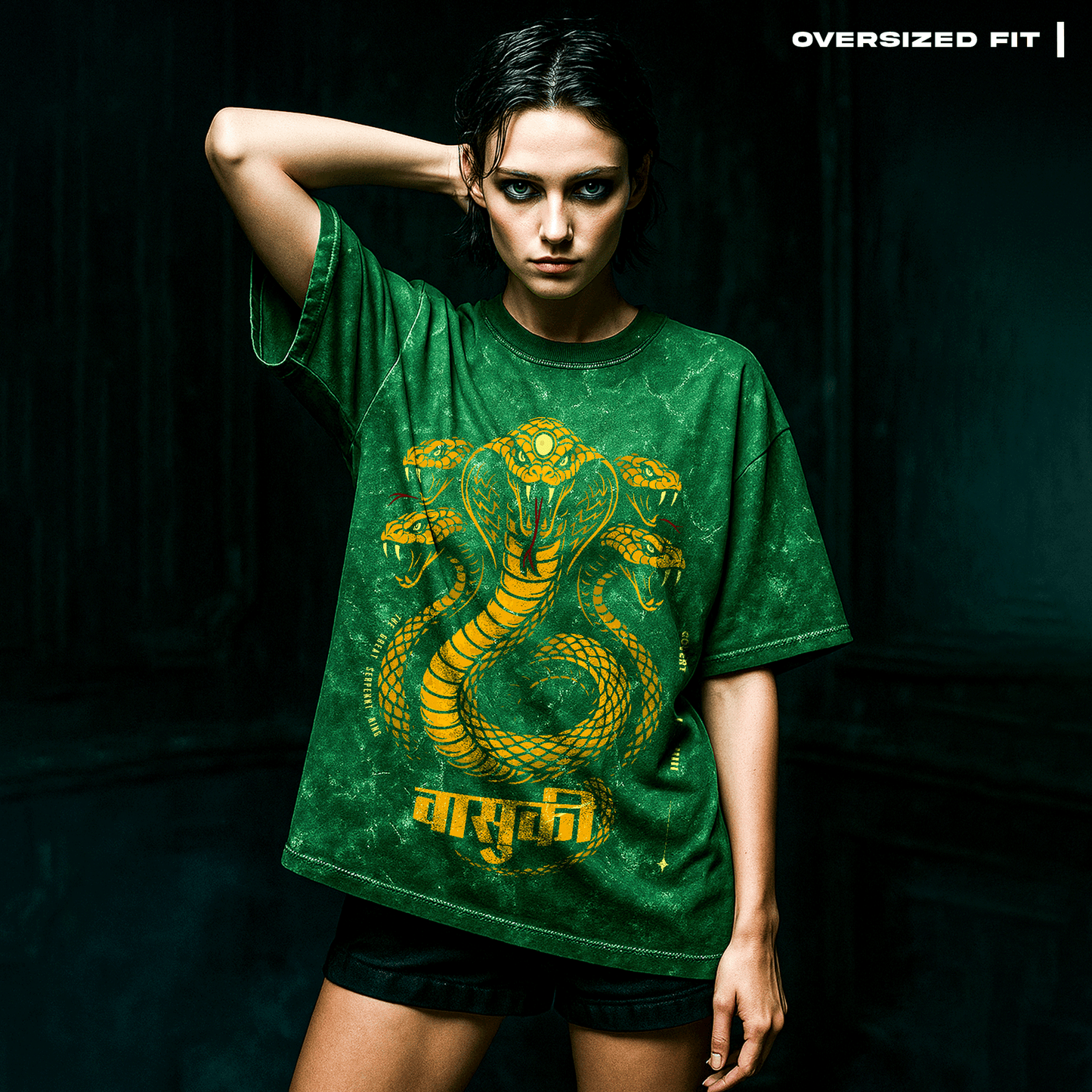 Person wearing a green t-shirt with a snake design on a dark background. Vasuki: The Serpent King T-Shirt