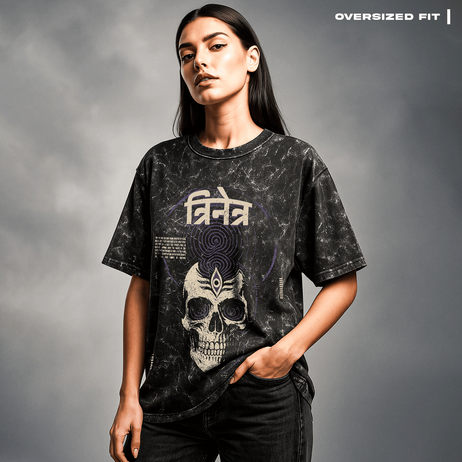 Person wearing an oversized black t-shirt with a skull design on a gray background Trinetra T-shirt Covert