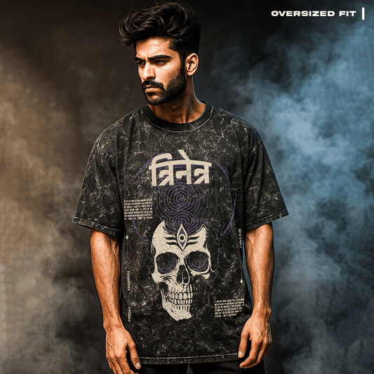 Man wearing a black t-shirt with a skull design and text on a dark background - Trinetra T-shirt Covert