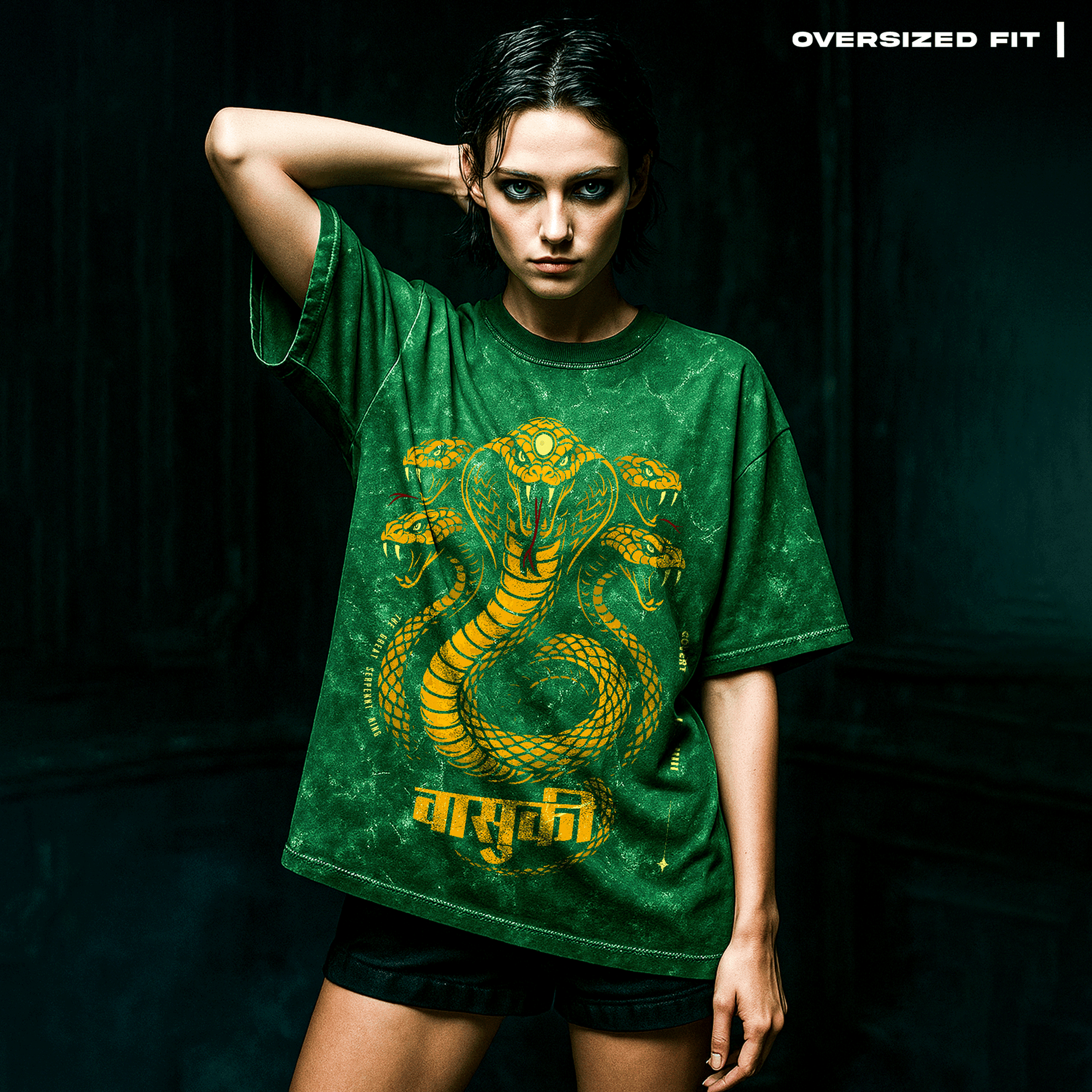 Person wearing a green t-shirt with a snake design on a dark background. Vasuki: The Serpent King T-Shirt