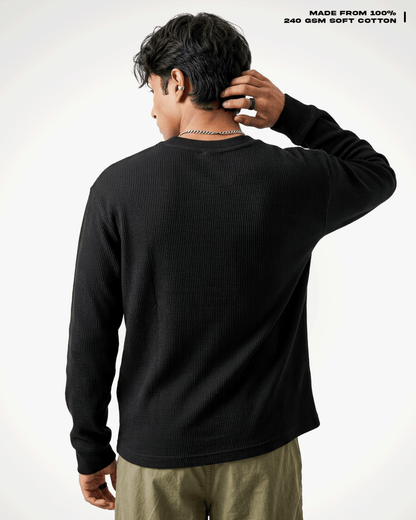 A man shown from the back wearing a Waffle Knit Henley Full Sleeve T-shirt and khaki pants against a clean white studio background. Text in the top right reads 'MADE FROM 100% 240 GSM SOFT COTTON'.