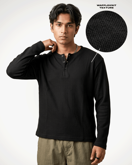 A man wearing a Waffle Knit Henley Full Sleeve T-shirt with a waffle knit texture, shown against a plain white background with a circular inset highlighting the fabric texture.